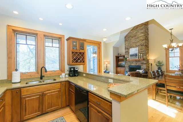 a kitchen with stainless steel appliances a sink and cabinets