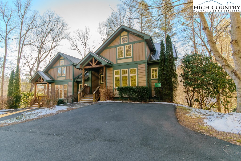 145 Rising Fawn Pass, Unit 17B Boone, NC 28607 - Photo 2 of 49 a front view of a house with a yard