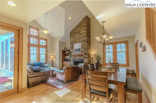 a living room with furniture fireplace and flat screen tv