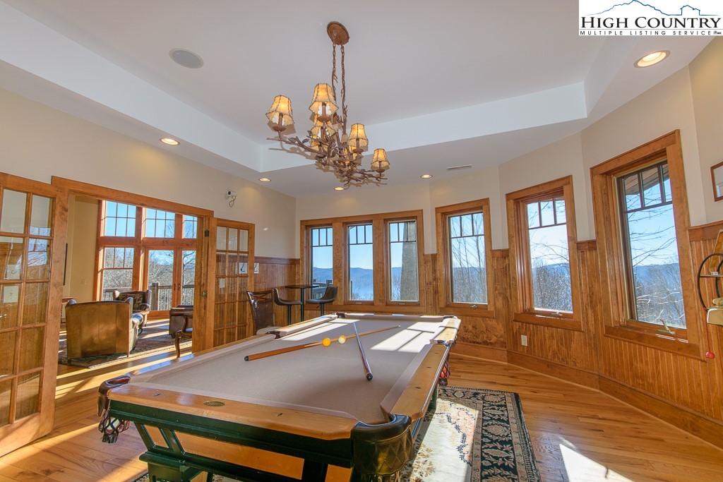 145 Rising Fawn Pass, Unit 17B Boone, NC 28607 - Photo 42 of 49 a view of a dining room with furniture window and wooden floor