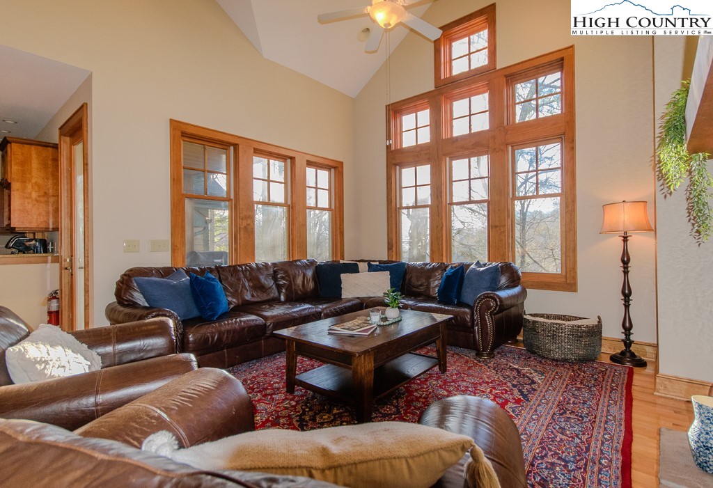 145 Rising Fawn Pass, Unit 17B Boone, NC 28607 - Photo 6 of 49 a living room with furniture and a large window