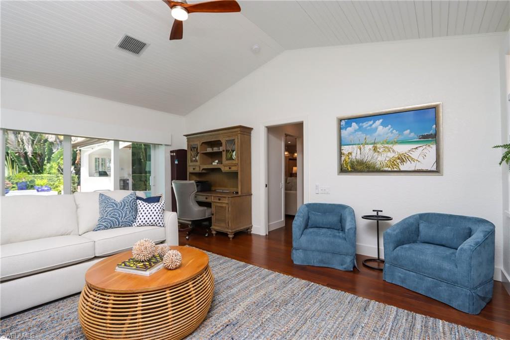 678 11th Avenue South Naples, FL 34102 - Photo 15 of 34 a living room with furniture a rug and a large window
