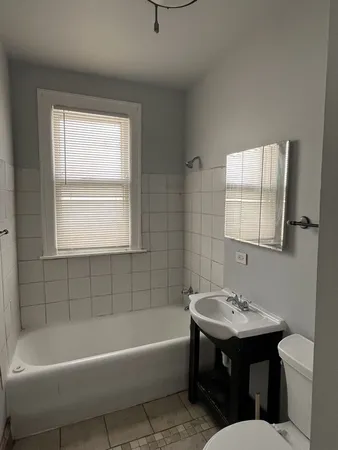 a bathroom with a sink bathtub and a toilet
