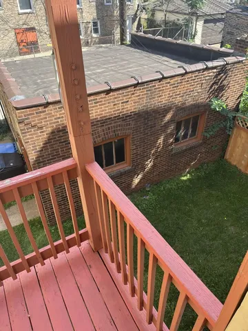 a view of a wooden deck and outdoor space