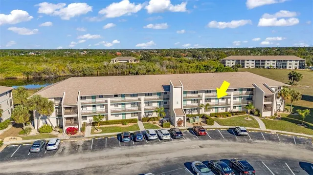 an aerial view of multiple house with a yard
