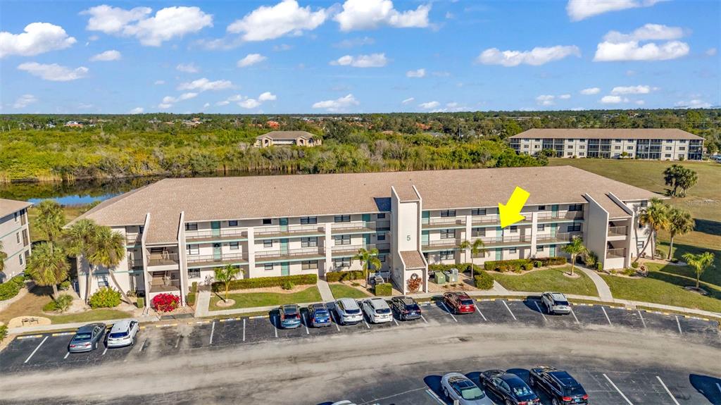 an aerial view of multiple house with a yard
