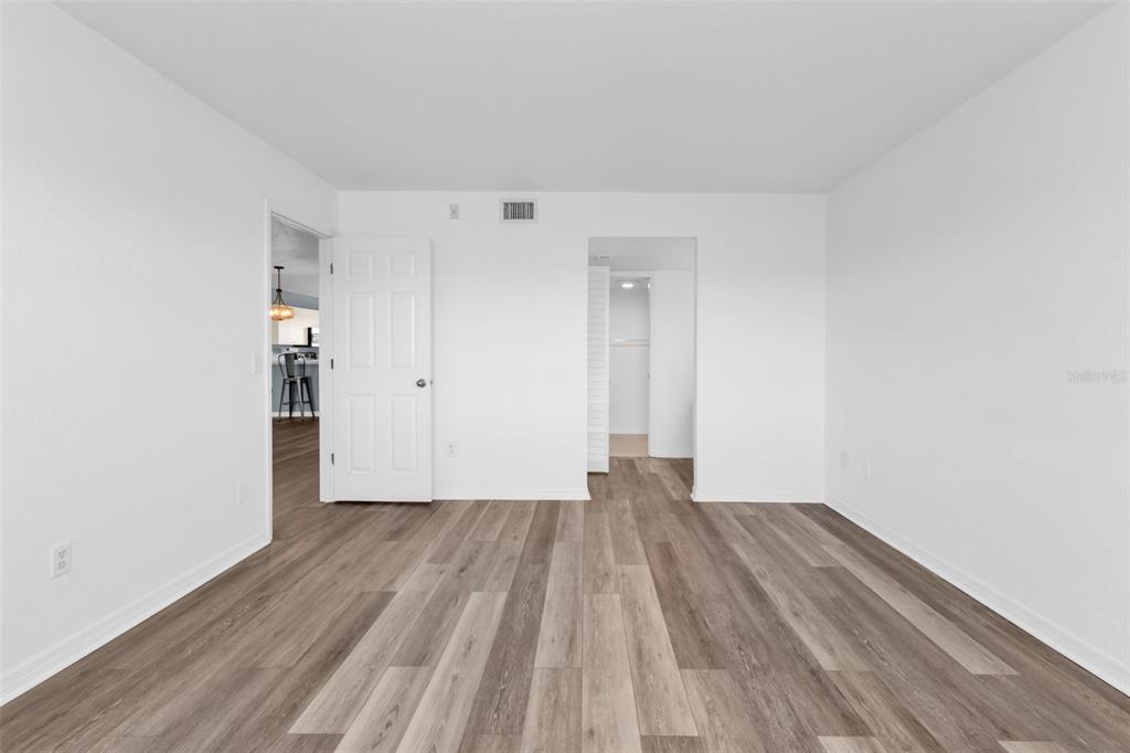 175 Kings Highway, Unit B6526 Punta Gorda, FL 33983 - Photo 13 of 44 a view of an empty room with wooden floor