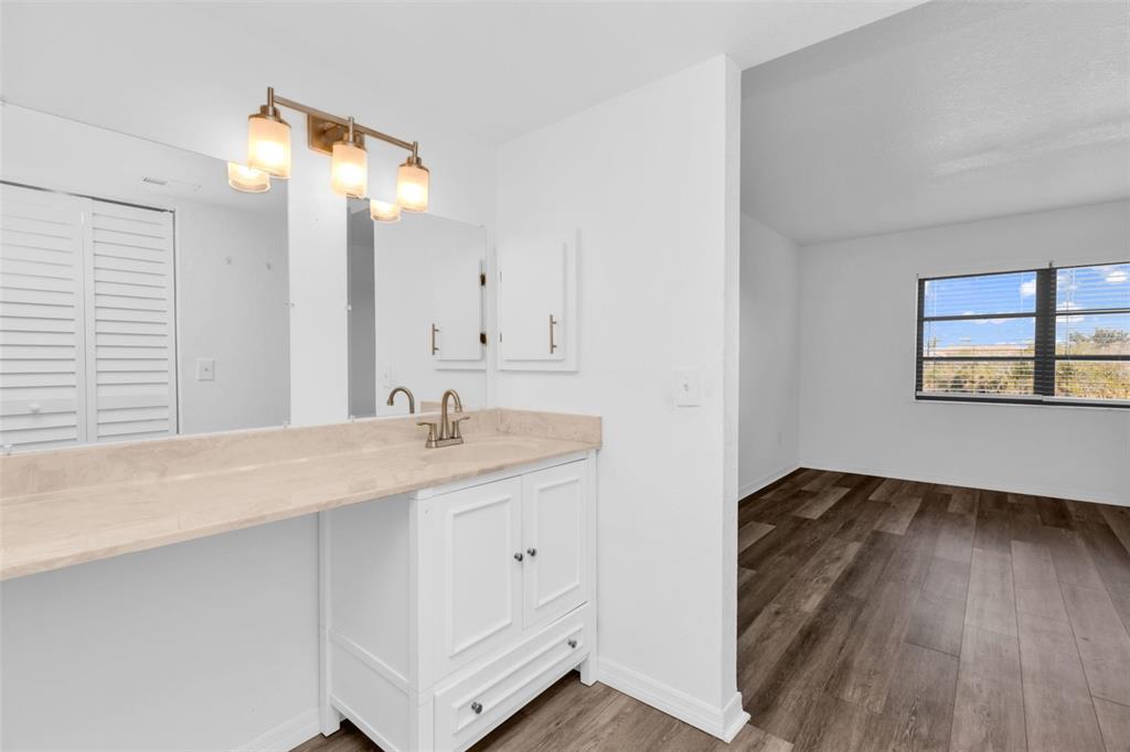 175 Kings Highway, Unit B6526 Punta Gorda, FL 33983 - Photo 16 of 44 a en suite bathroom with a granite countertop sink