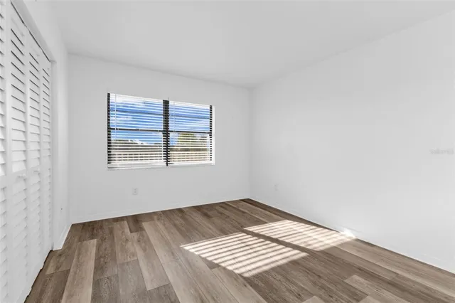 a view of wooden floor in an empty room