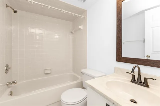 a bathroom with a sink a toilet and a bathtub