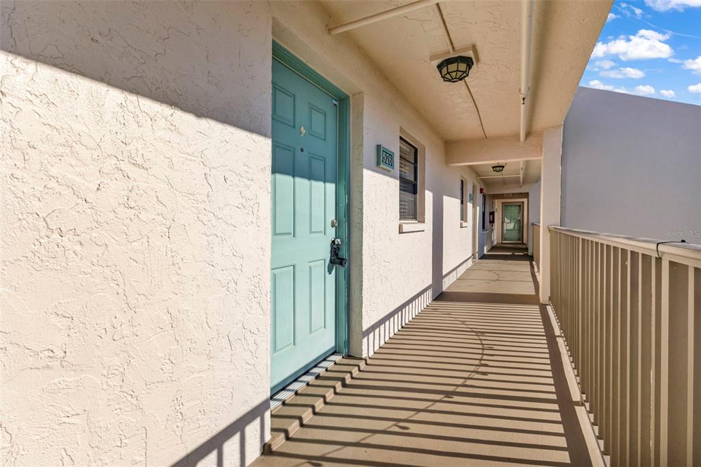 175 Kings Highway, Unit B6526 Punta Gorda, FL 33983 - Photo 3 of 44 a view of a hallway with wooden floor and staircase