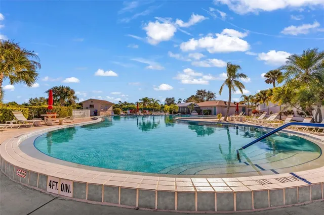 a view of a swimming pool with a sitting space