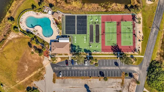aerial view of a house with swimming pool and sitting area