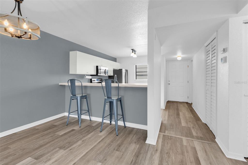175 Kings Highway, Unit B6526 Punta Gorda, FL 33983 - Photo 8 of 44 a view of a kitchen with dining table and chairs