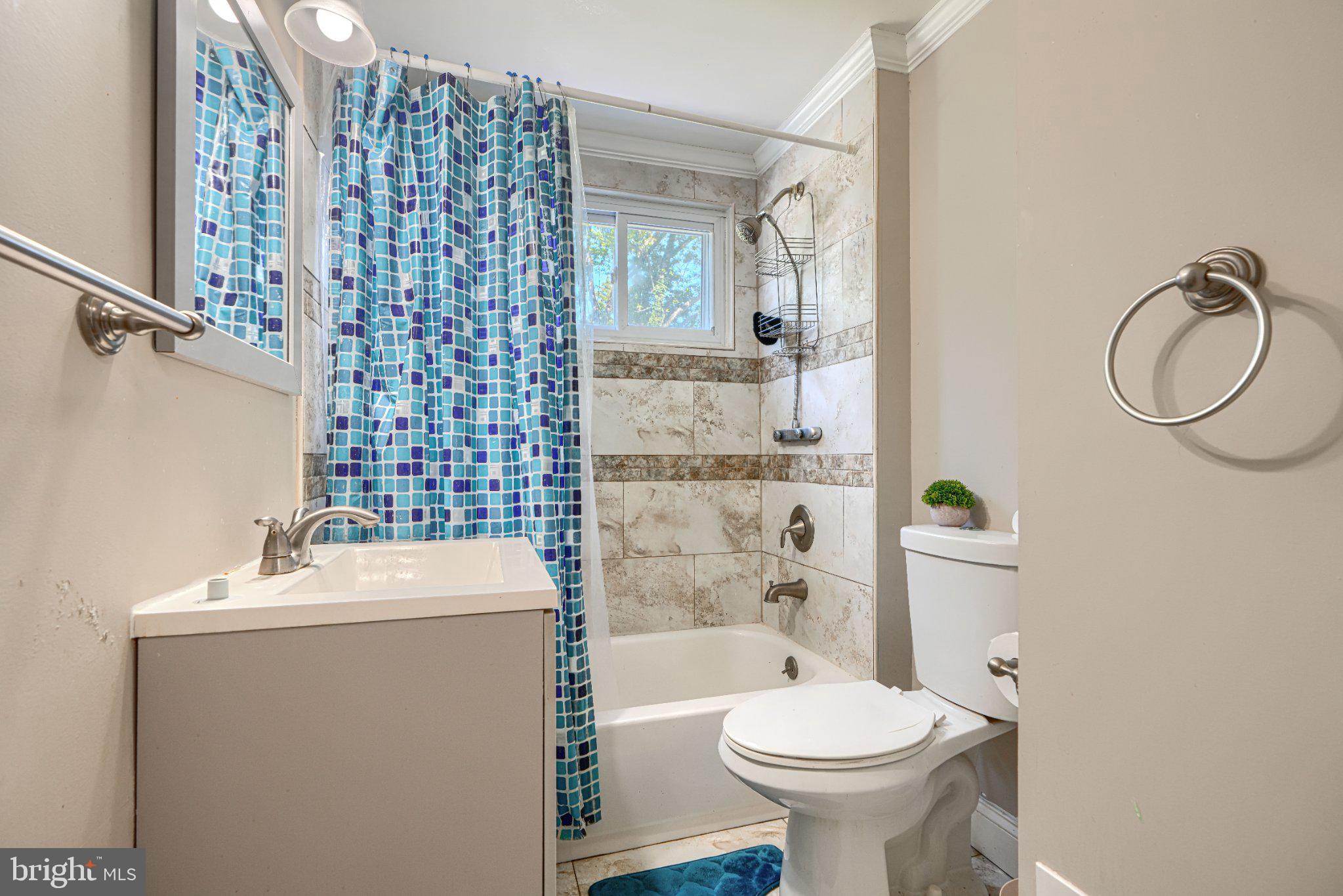 3708 Cassen Road Randallstown, MD 21133 - Photo 28 of 38 a bathroom with a sink toilet and shower