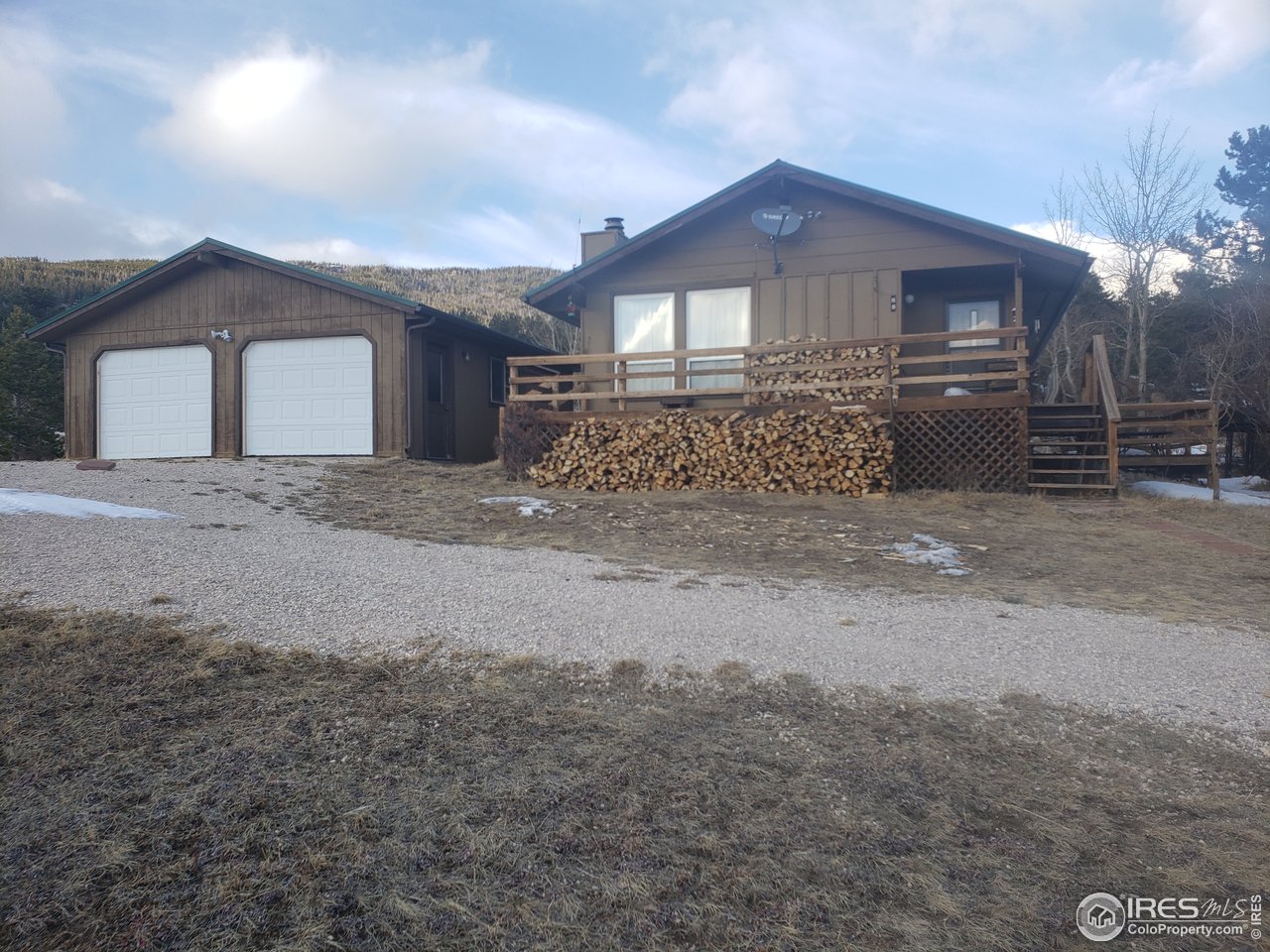 88 Cimarron Road Red Feather Lakes, CO 80545 - Photo 2 of 26 large parking area with a big double car garage