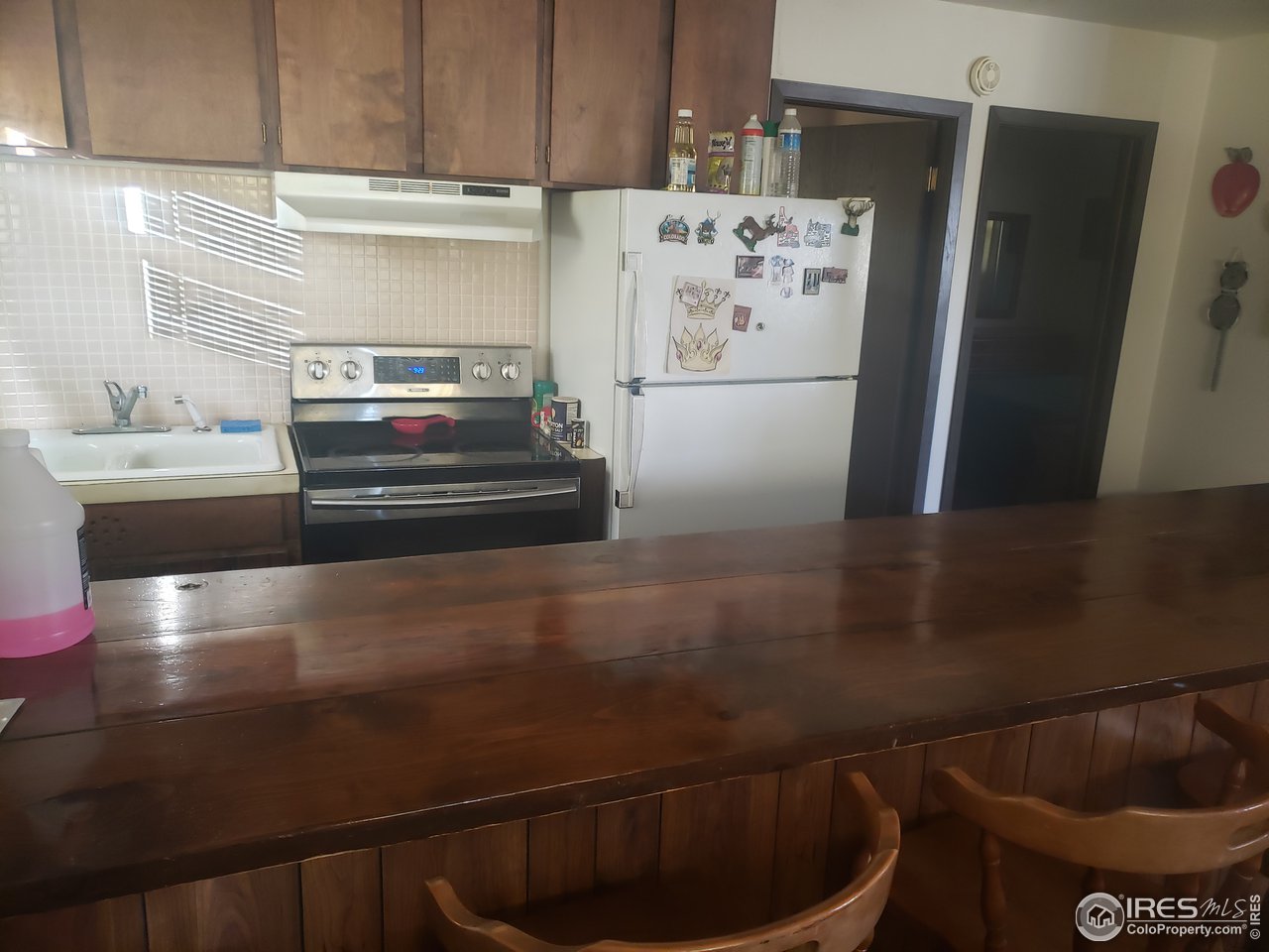 88 Cimarron Road Red Feather Lakes, CO 80545 - Photo 23 of 26 full sized refrigerator in the kitchen