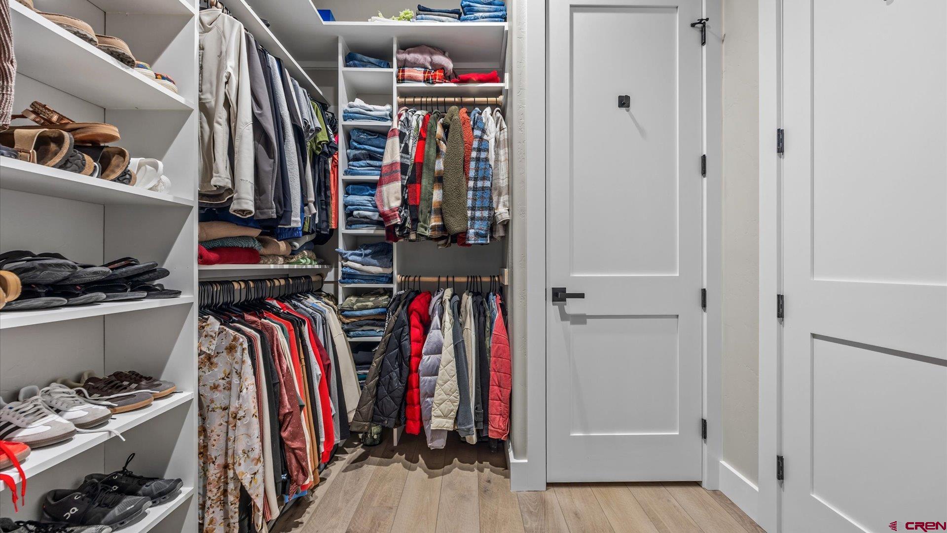 1774 Trapper Court Delta, CO 81416 - Photo 18 of 45 Huge closet with built-ins off of the primary bath. And check out the linen closet in the closet!