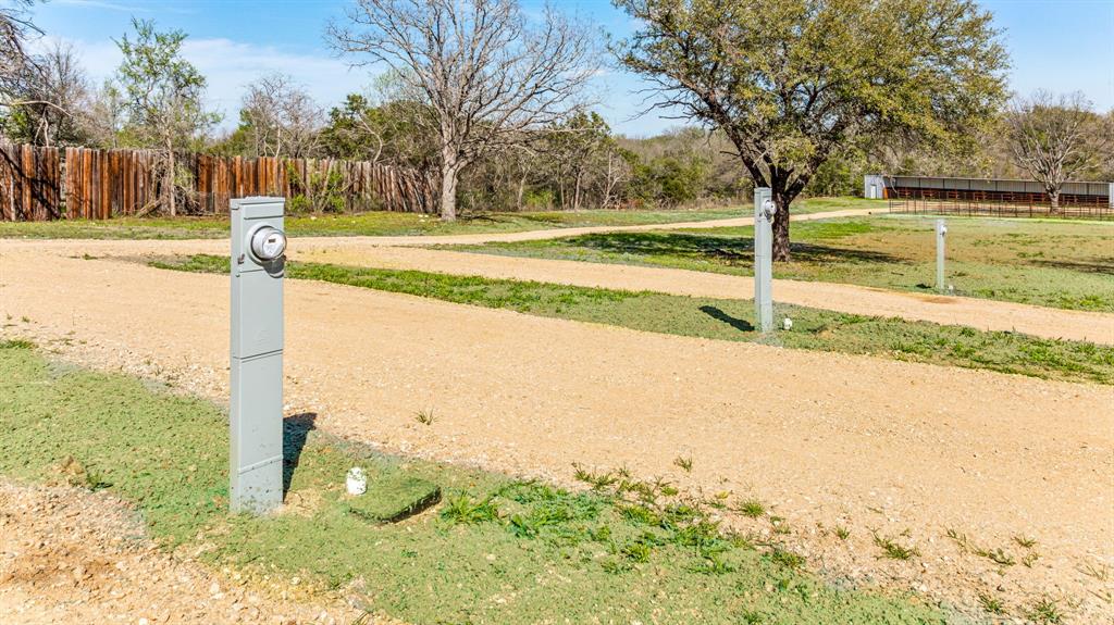 247 South Caddo Street Lipan, TX 76462 - Photo 1 of 29 a view of a yard with an trees