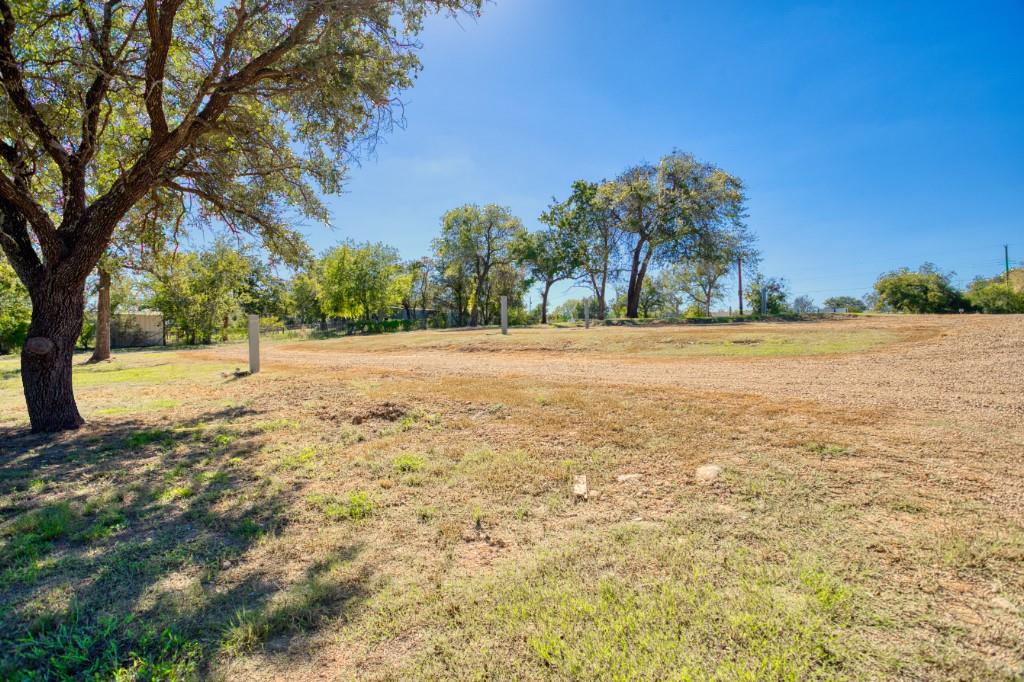 247 South Caddo Street Lipan, TX 76462 - Photo 17 of 29 a view of yard with large trees