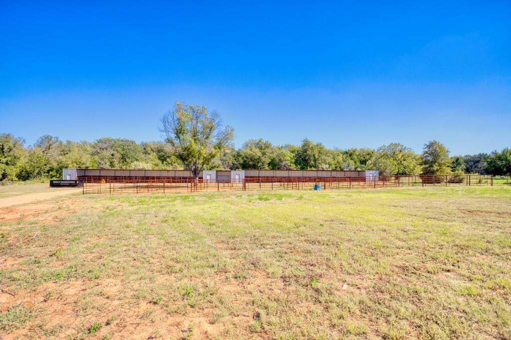 247 South Caddo Street Lipan, TX 76462 - Photo 10 of 29 a view of outdoor space with swimming pool and green space