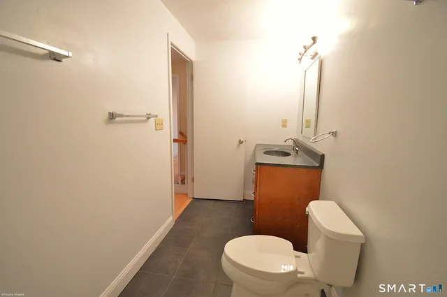 a bathroom with a toilet and a sink