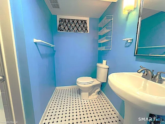 a bathroom with a sink and a toilet