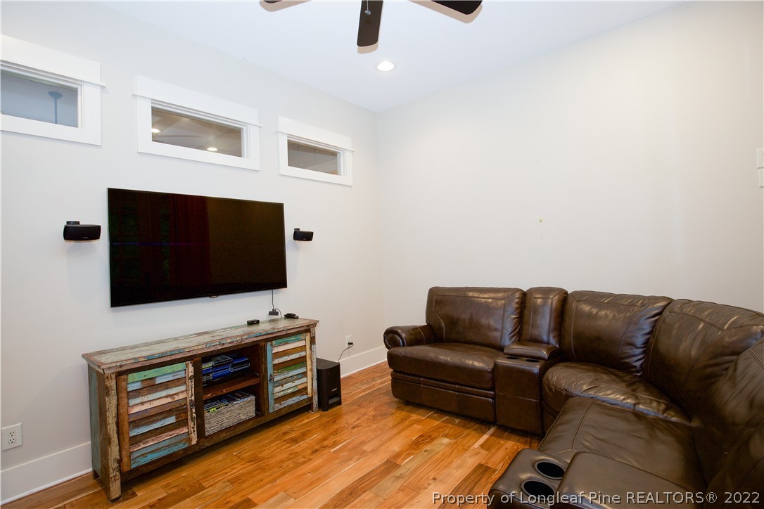 480 Highland Road Southern Pines, NC 28387 - Photo 7 of 50 a living room with furniture and a flat screen tv