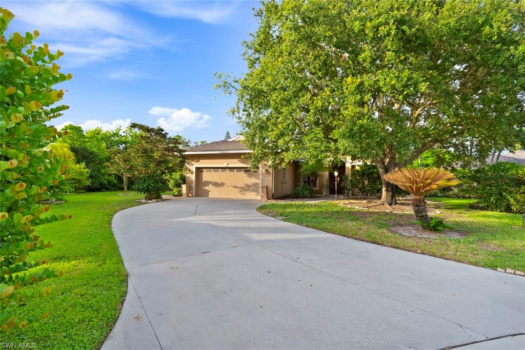3262 Citron Drive Naples, FL 34120 - Photo 2 of 38 a view of a house with a yard
