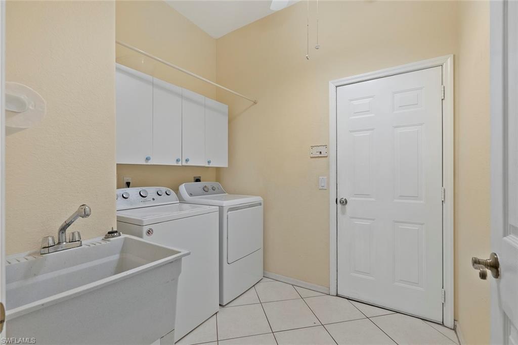 3262 Citron Drive Naples, FL 34120 - Photo 25 of 38 a utility room with dryer and washer