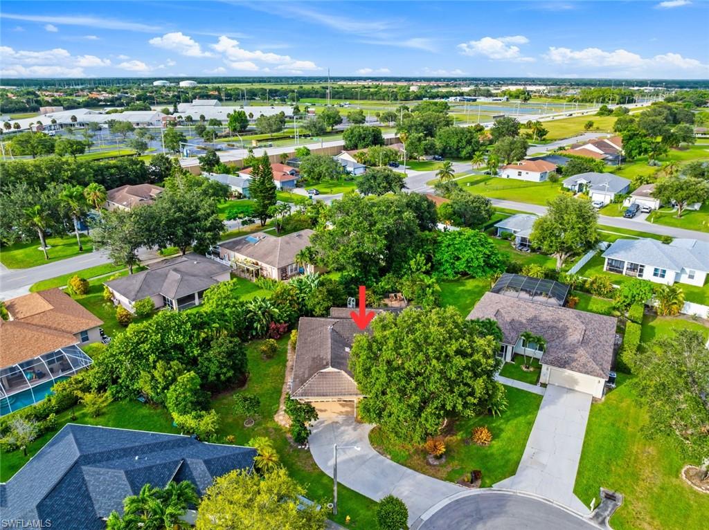 3262 Citron Drive Naples, FL 34120 - Photo 3 of 38 an aerial view of residential houses with outdoor space and street view