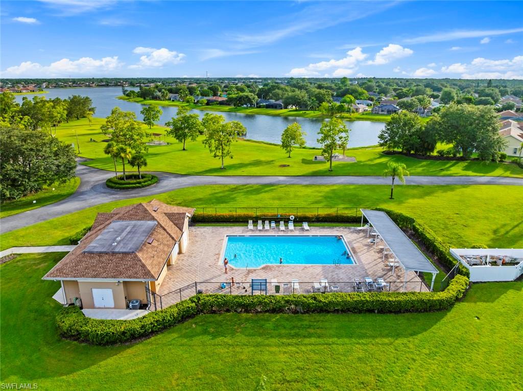 3262 Citron Drive Naples, FL 34120 - Photo 38 of 38 a view of a swimming pool with a yard