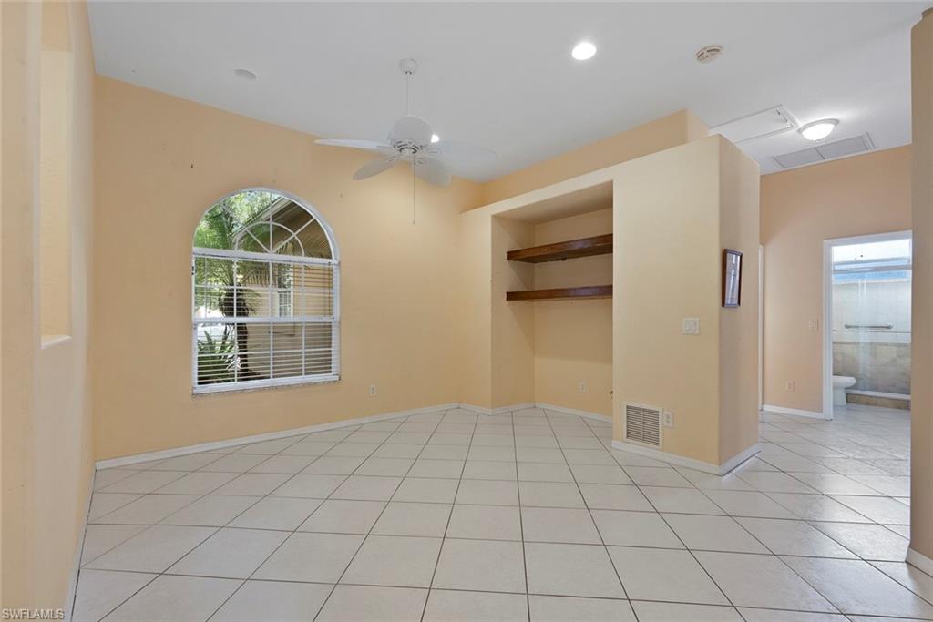 3262 Citron Drive Naples, FL 34120 - Photo 9 of 38 a view of an empty room with a window