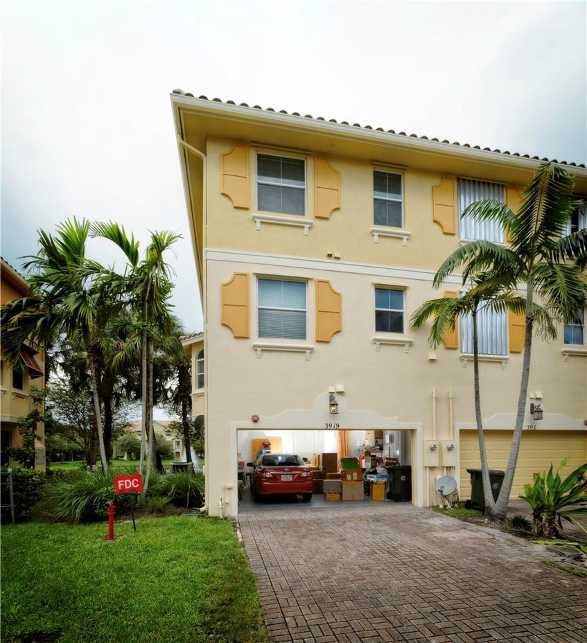 3919 Passion Flower Road Pompano Beach, FL 33073 - Photo 2 of 22 two car garage