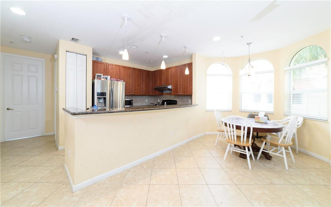 3919 Passion Flower Road Pompano Beach, FL 33073 - Photo 7 of 22 kitchen with dining area