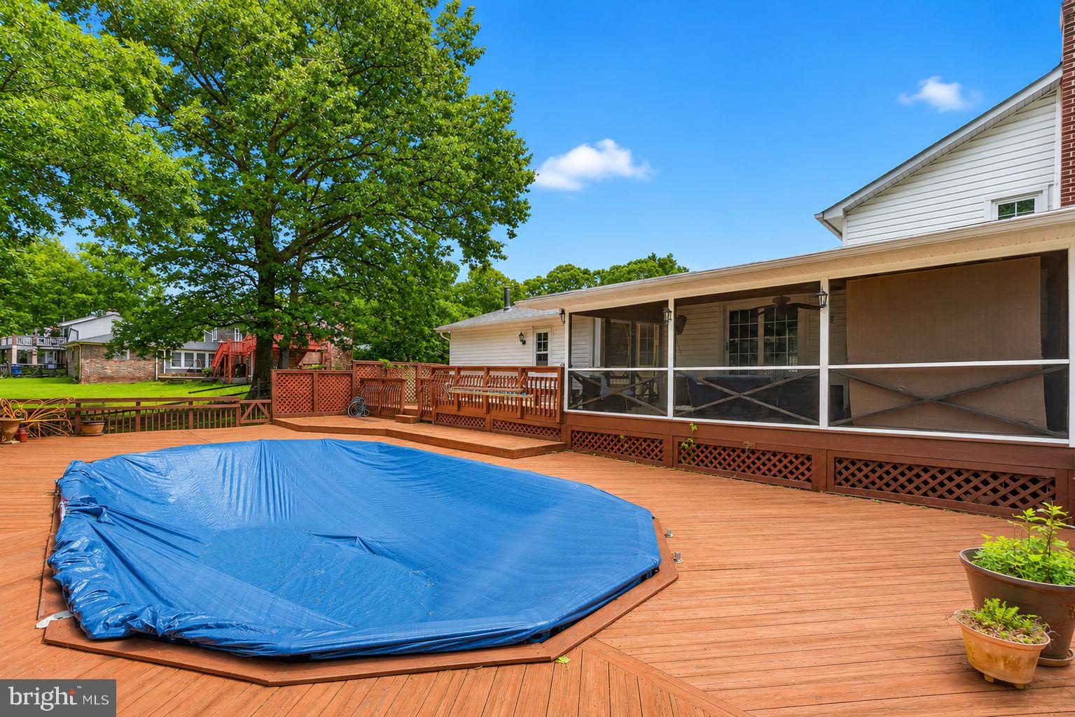 507 Clarks Run Road La Plata, MD 20646 - Photo 3 of 49 Spacious deck with pool cover and greenery.