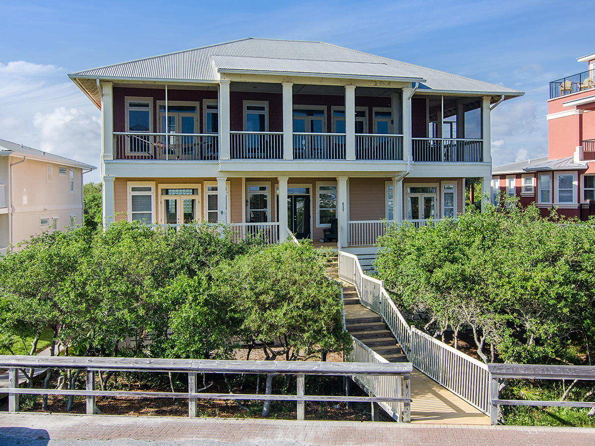 617 Blue Mountain Road Santa Rosa Beach, FL 32459 - Photo 1 of 24 a view of a large building next to a yard
