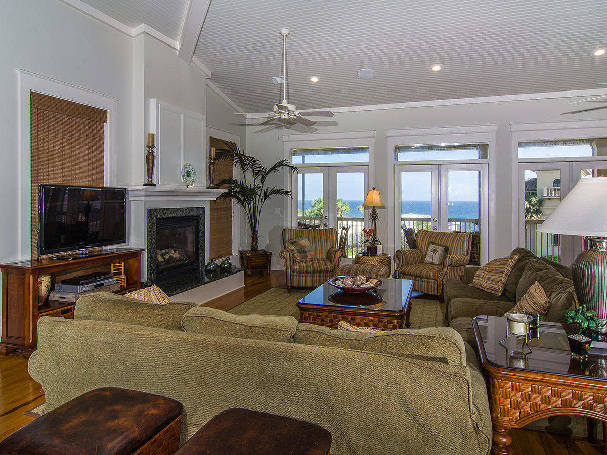 617 Blue Mountain Road Santa Rosa Beach, FL 32459 - Photo 9 of 24 a living room with furniture a flat screen tv and a fireplace