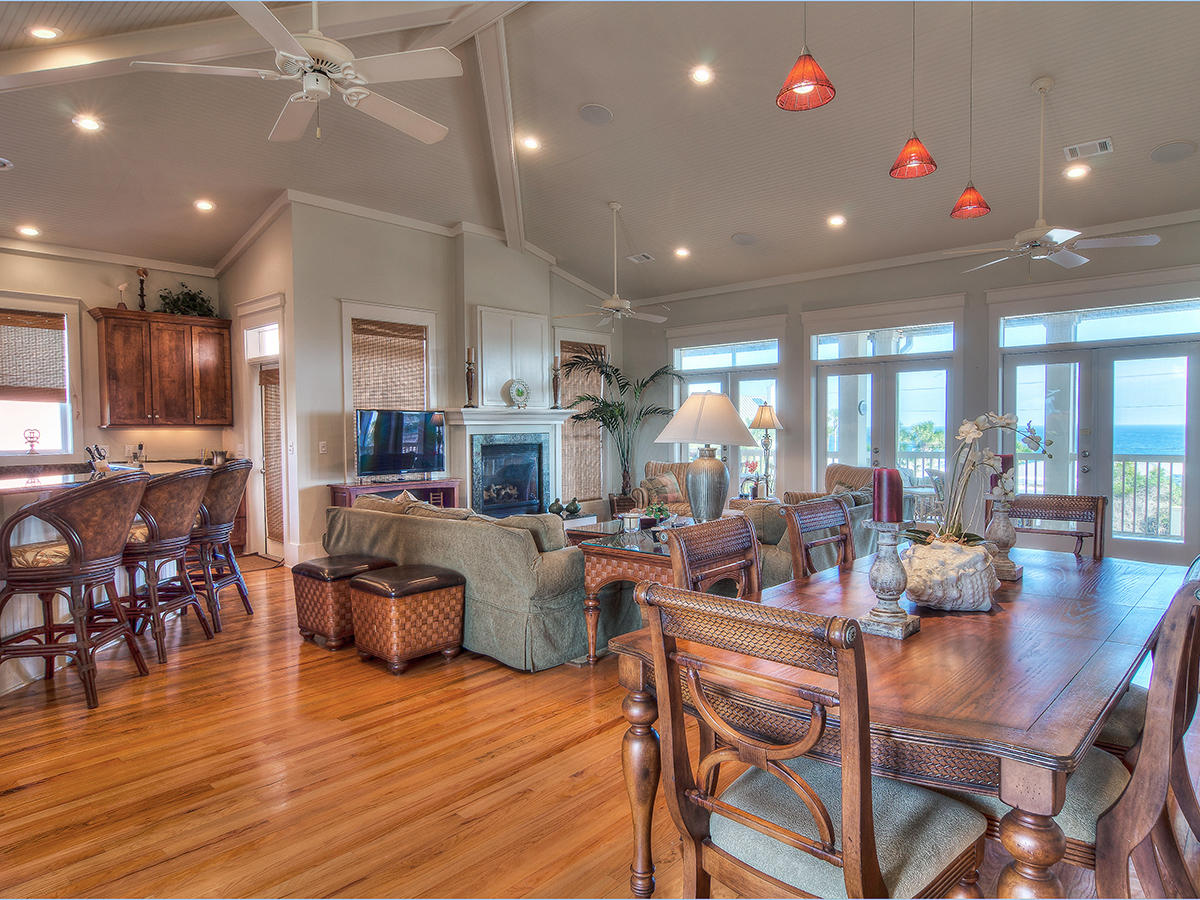 617 Blue Mountain Road Santa Rosa Beach, FL 32459 - Photo 10 of 24 a view of a dining room with furniture window and wooden floor