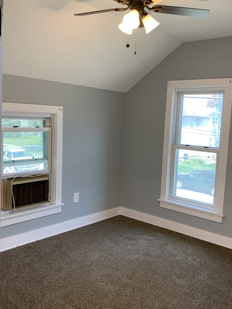 370 Ryerson Avenue Elgin, IL 60123 - Photo 11 of 21 a view of an empty room with a window