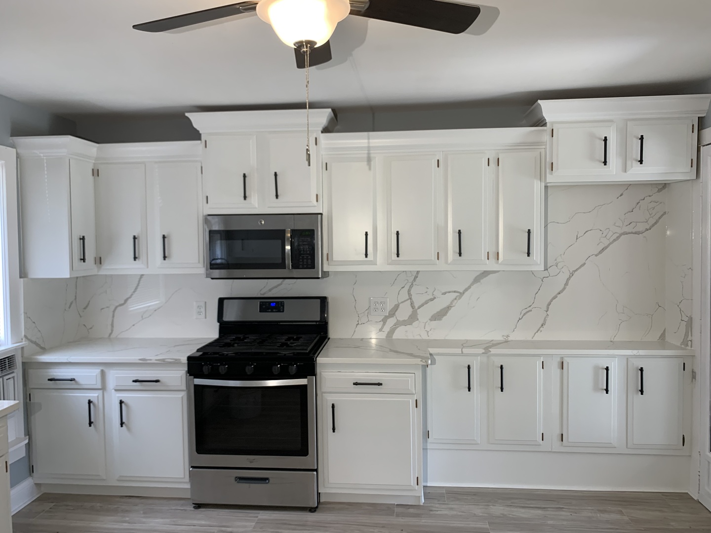 370 Ryerson Avenue Elgin, IL 60123 - Photo 5 of 21 a kitchen with white cabinets and appliances
