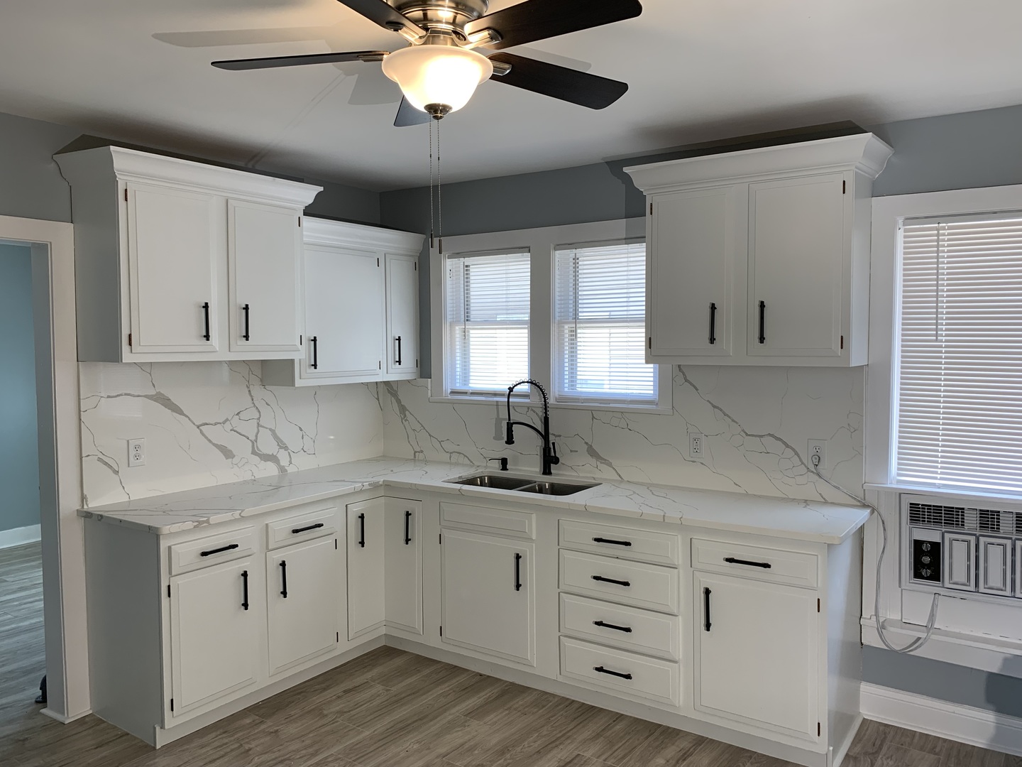 370 Ryerson Avenue Elgin, IL 60123 - Photo 7 of 21 a kitchen with cabinets appliances a sink and a window