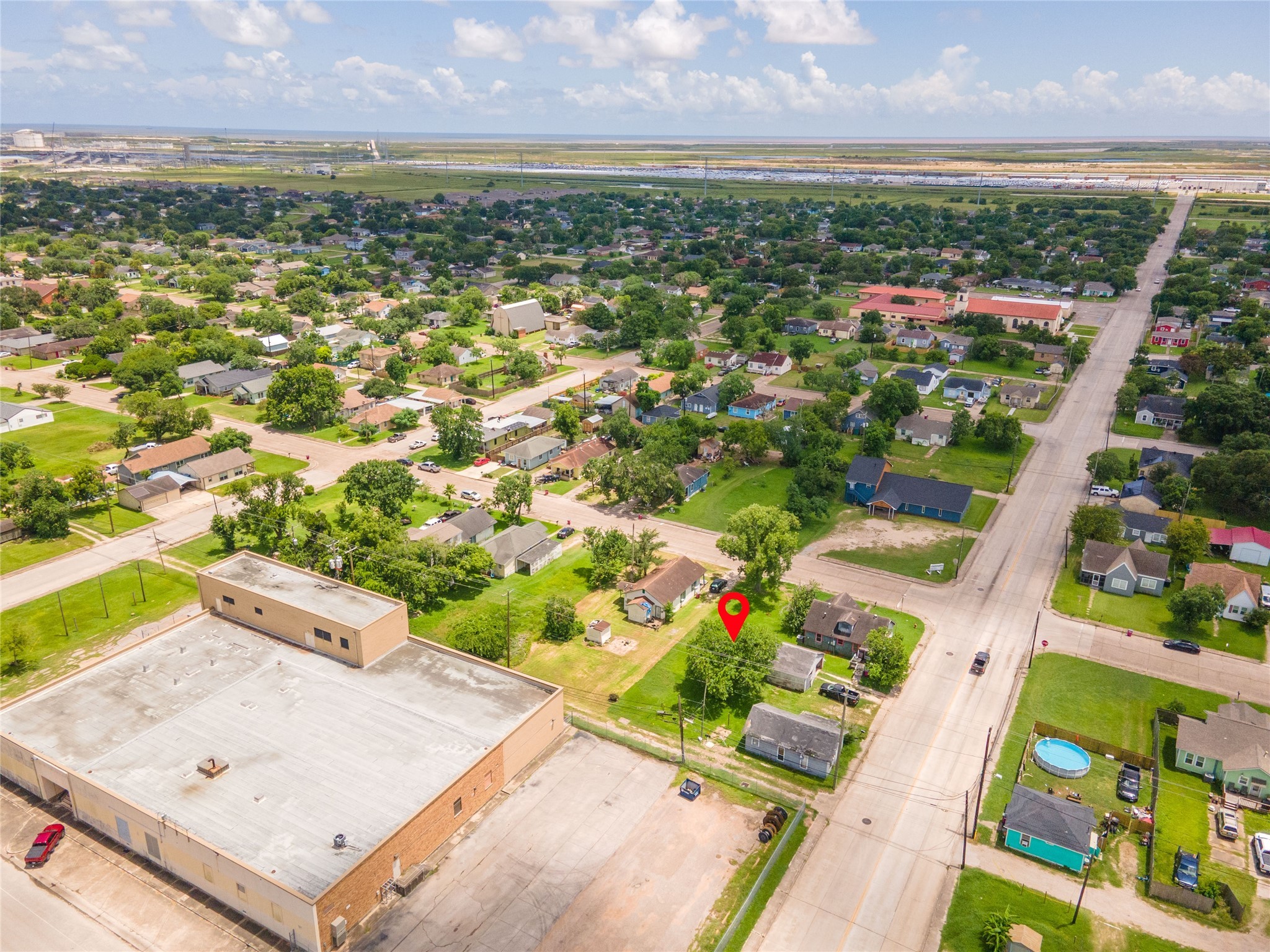1026 West 4th Street Freeport, TX 77541 - Photo 12 of 12 an aerial view of residential houses with outdoor space and trees