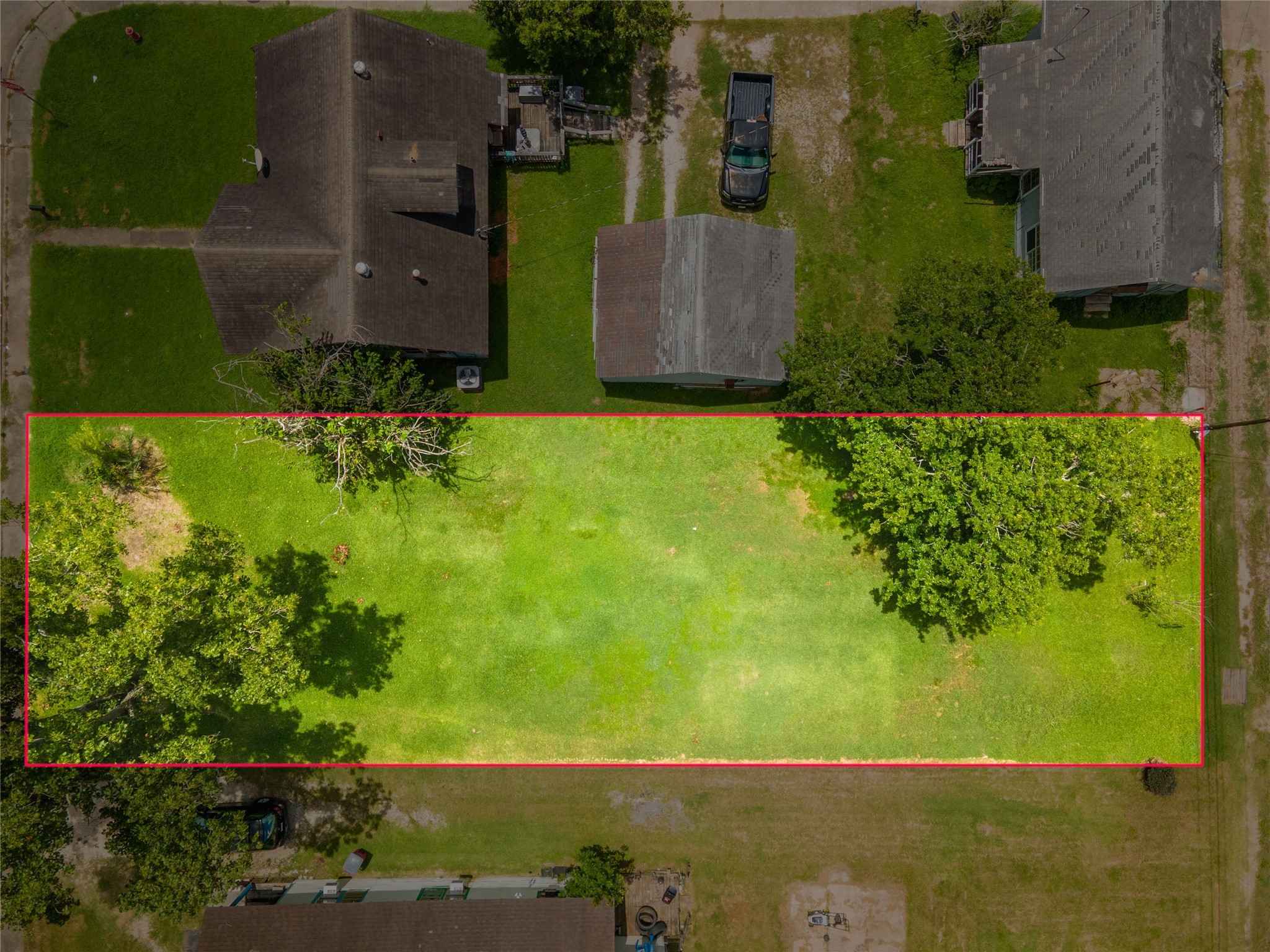 1026 West 4th Street Freeport, TX 77541 - Photo 10 of 12 an aerial view of a residential houses with outdoor space and trees