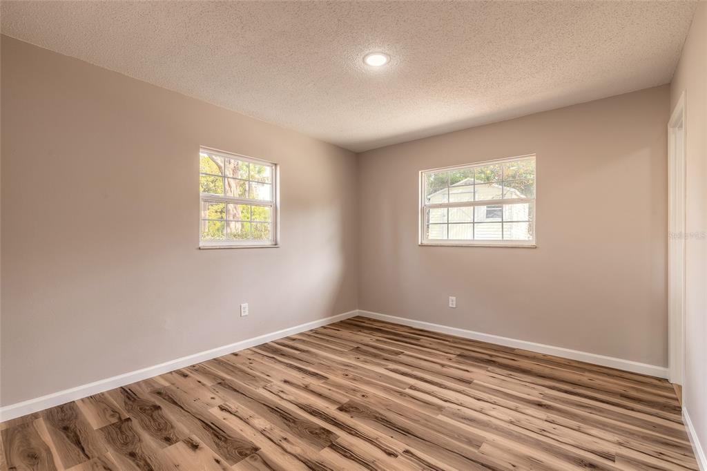 1605 Bradford Road Edgewater, FL 32132 - Photo 22 of 30 a view of a room with wooden floor and windows