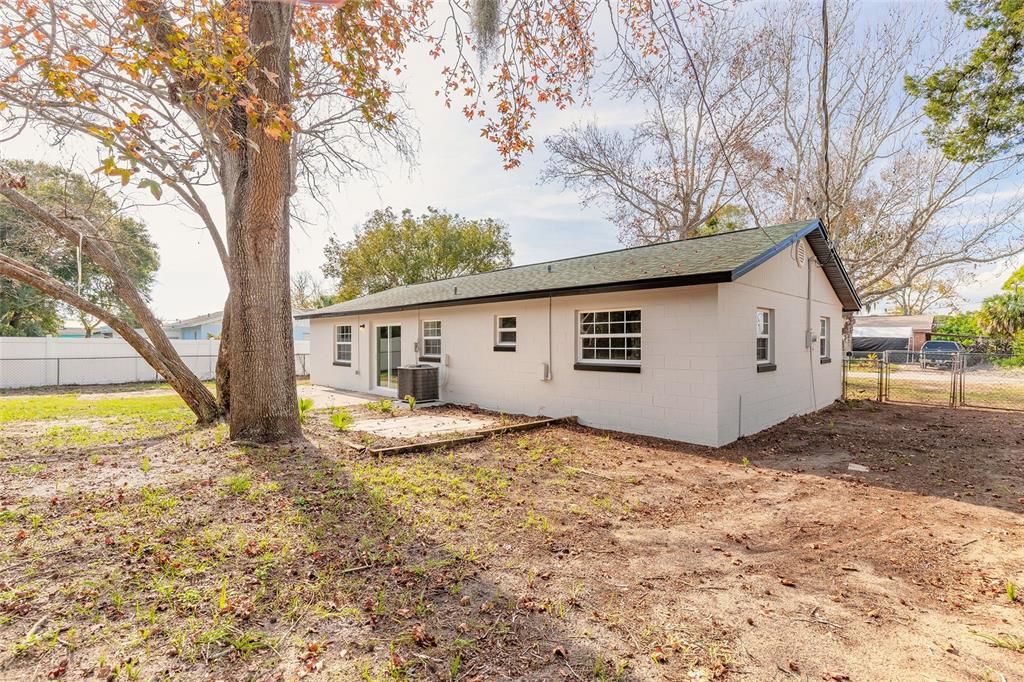 1605 Bradford Road Edgewater, FL 32132 - Photo 29 of 30 a view of a house with backyard and trees