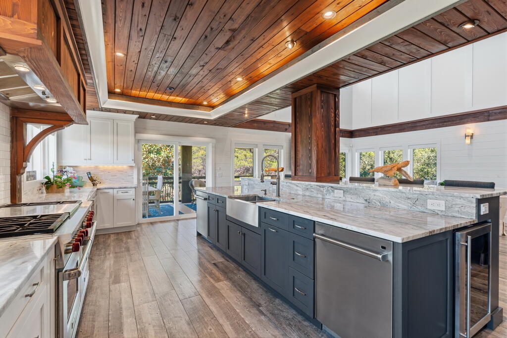 278 Savelle Drive Santa Rosa Beach, FL 32459 - Photo 12 of 157 a kitchen with stainless steel appliances granite countertop lots of counter top space and wooden floor