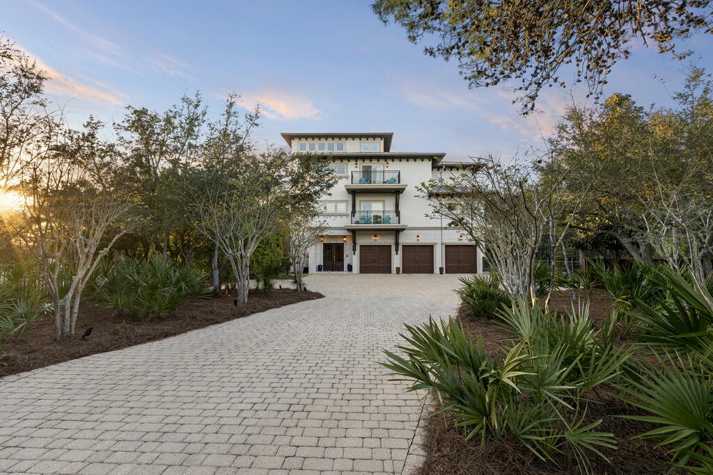 278 Savelle Drive Santa Rosa Beach, FL 32459 - Photo 124 of 157 a front view of a house with a yard and trees