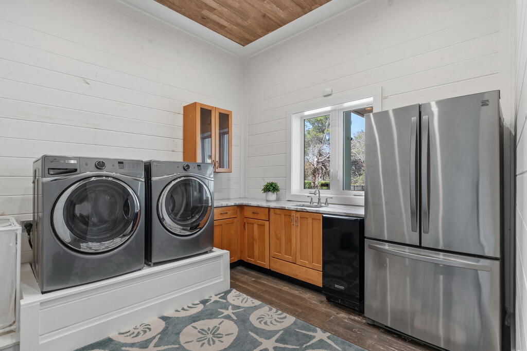 278 Savelle Drive Santa Rosa Beach, FL 32459 - Photo 22 of 157 a kitchen with stainless steel appliances granite countertop a refrigerator a stove and a sink with large window