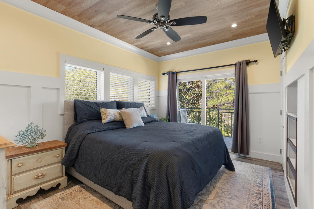 278 Savelle Drive Santa Rosa Beach, FL 32459 - Photo 55 of 157 a bed sitting in a spacious bedroom next to a window